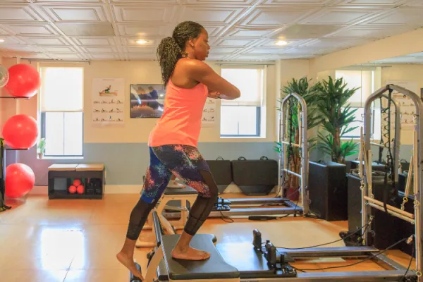 Standing balance work on the reformer