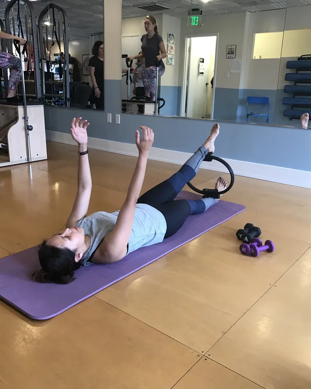 Mat work with a Pilates ring